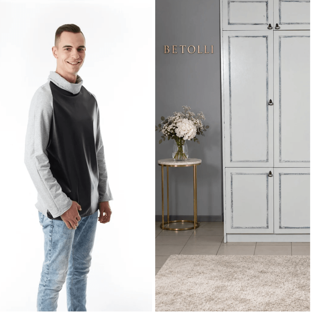 BETOLLI Brusli men’s sweatshirt with a black faux leather front, grey long sleeves and a folded grey collar, worn with jeans.