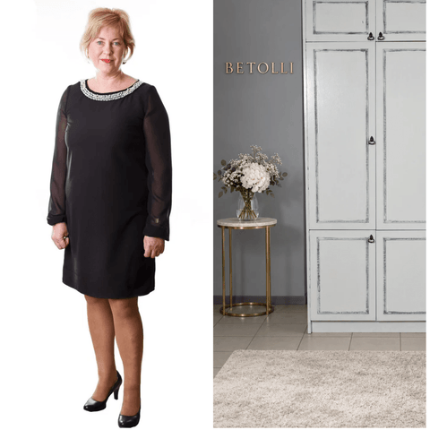 Model wearing the BETOLLI Dimond black dress with sheer long chiffon sleeves, a beaded round neckline and a straight silhouette.