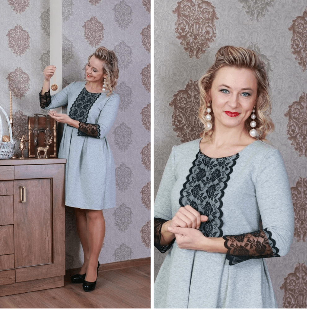 Model wearing the BETOLLI Lucky grey dress with black floral lace on the front and sleeve cuffs, a defined waist and pleated skirt.