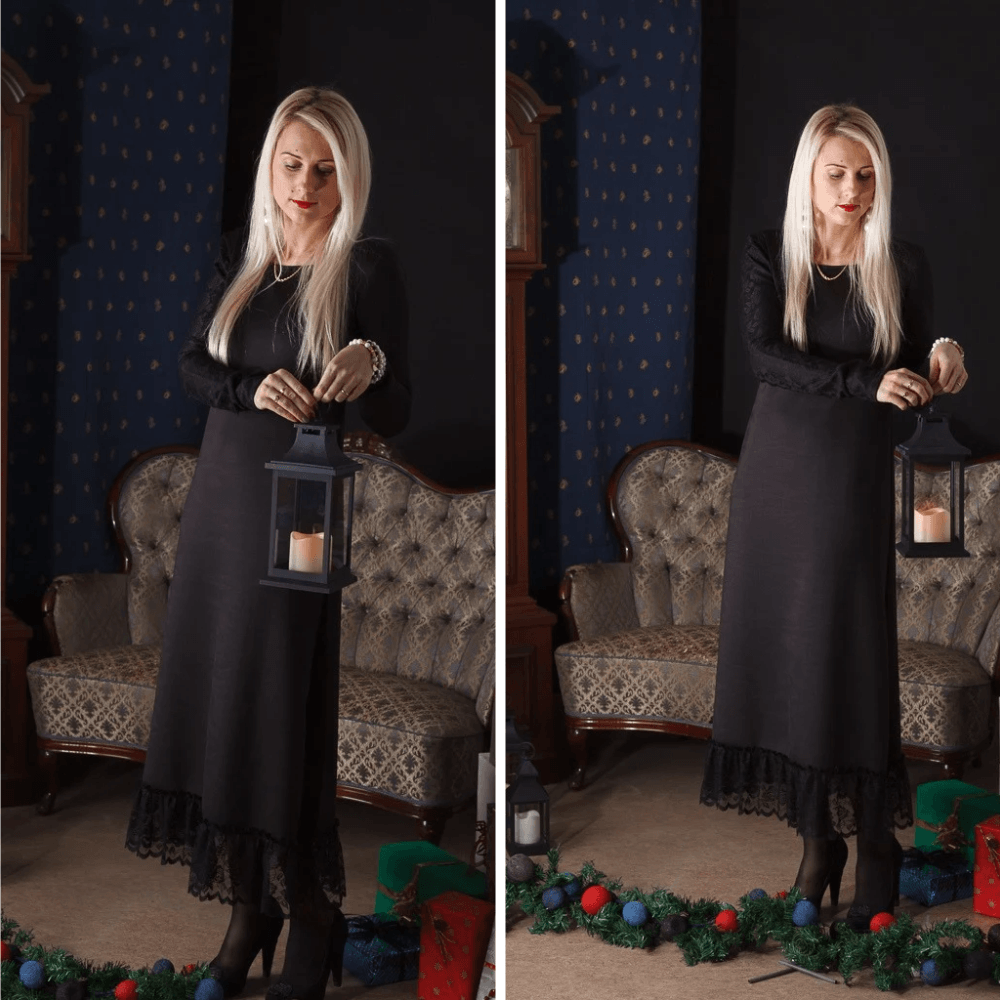BETOLLI Winter Lady black maxi dress with long sleeves and a lace-trimmed hem, worn by a model holding a lantern.